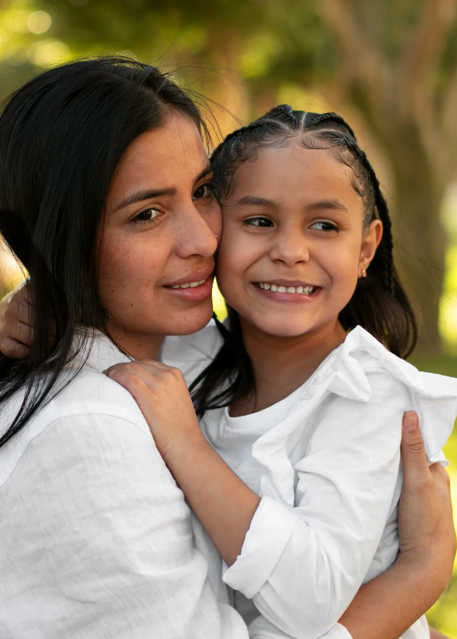 Mother and daughter smiling together